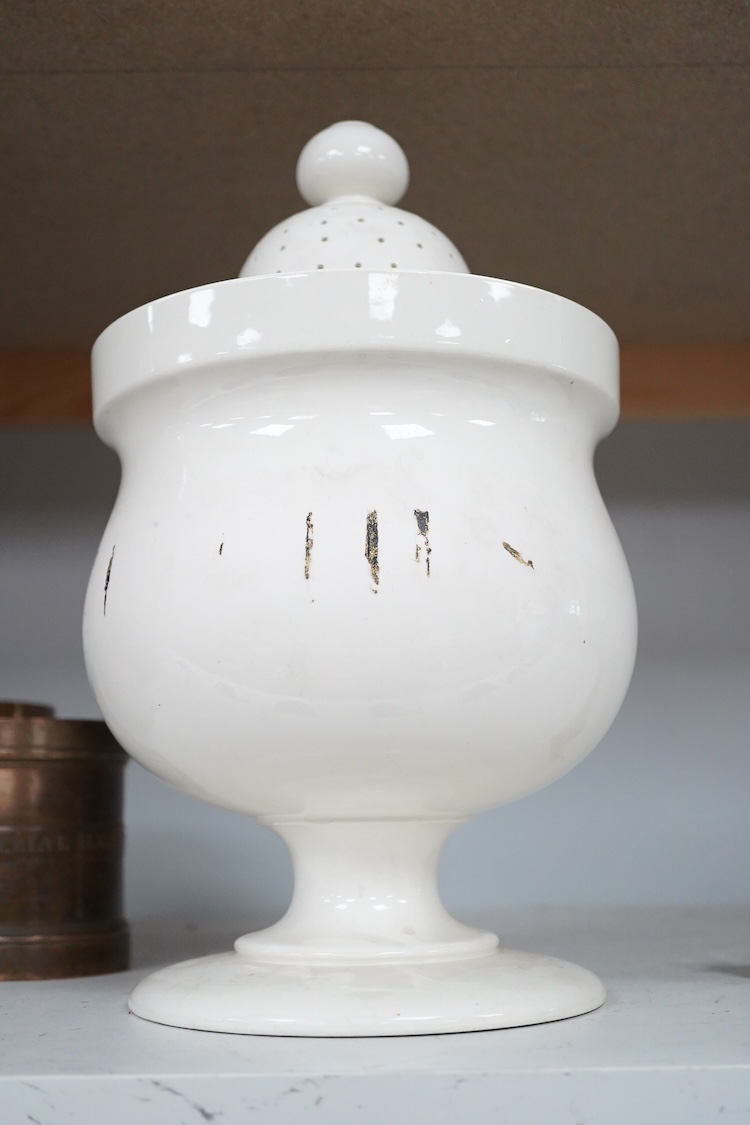 A Victorian pottery pedestal leeches jar and pierced cover, with the remains of the painted word ‘leeches’ around the body of the jar, 30.5cm high